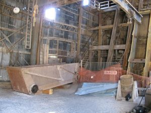 The inside of the shafthouse shows the large materials car lowered.